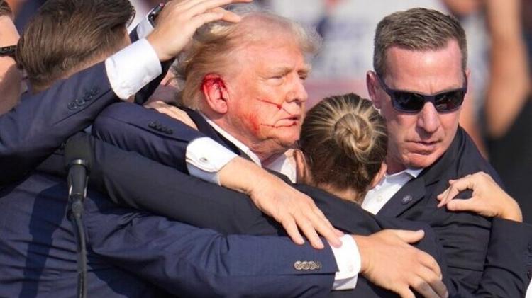 Trump é retirado de comício ferido após disparos de tiros